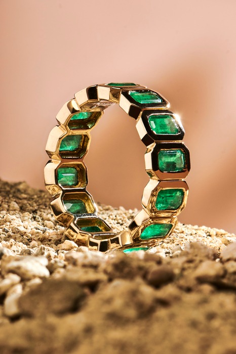 A ring with emerald stones