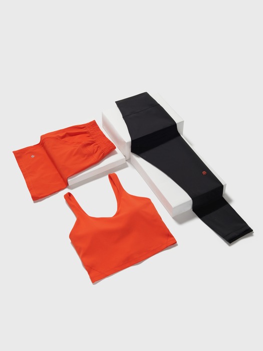 Women jogging wear in orange and black color