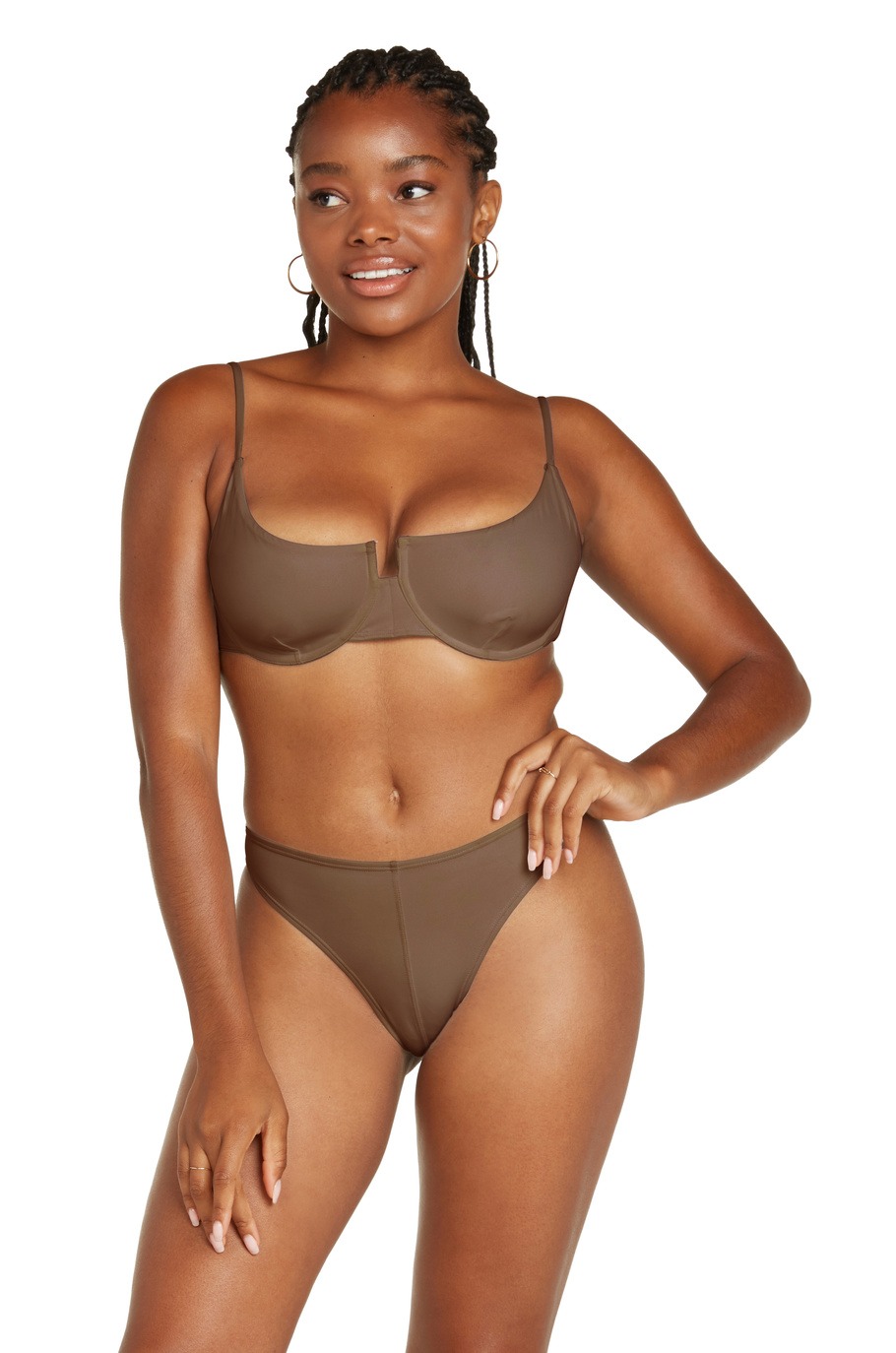 A dark female model with brown bra and panty front view