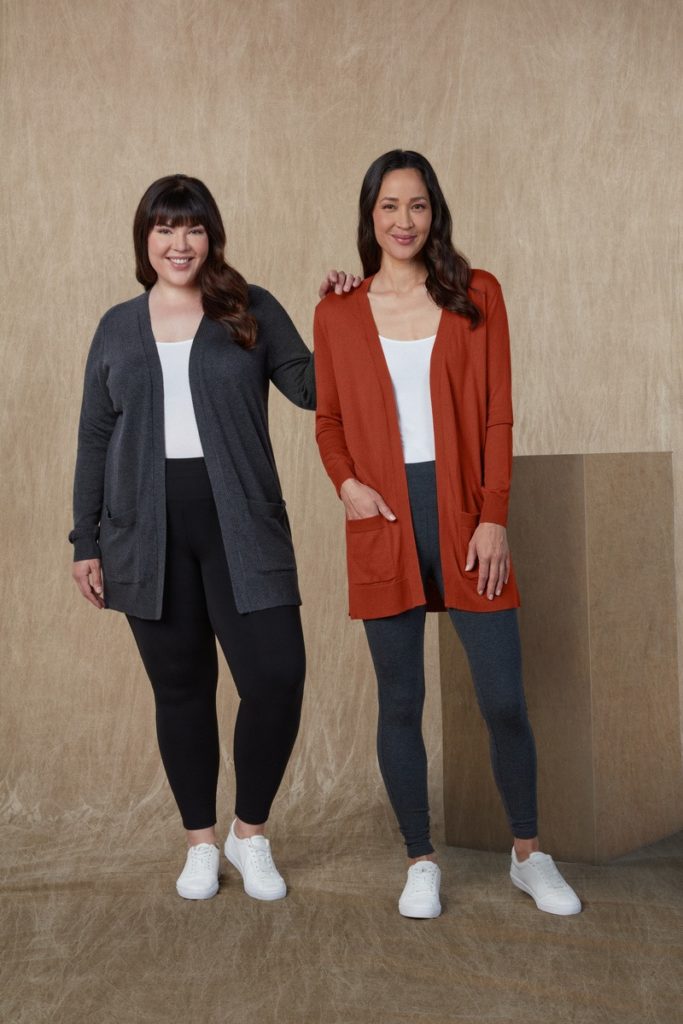 Two female models with leggings , tshirt and an over coat