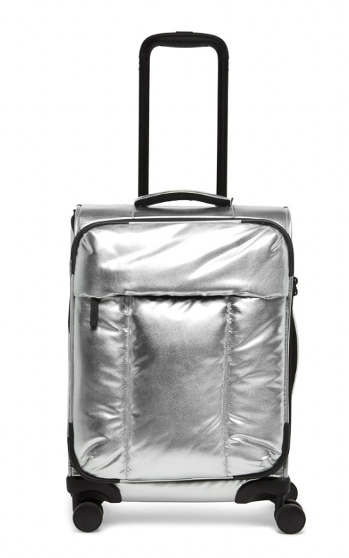 A grey colored trolley suitcase