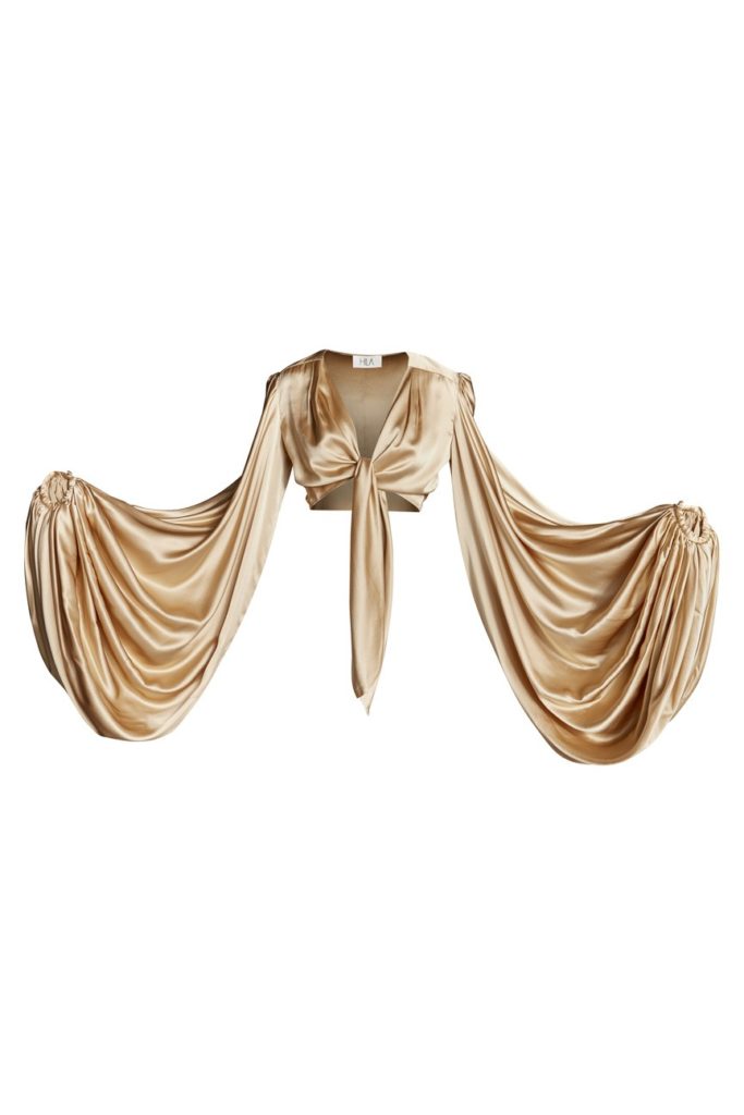 Image of a knot front crop stain top in gold color