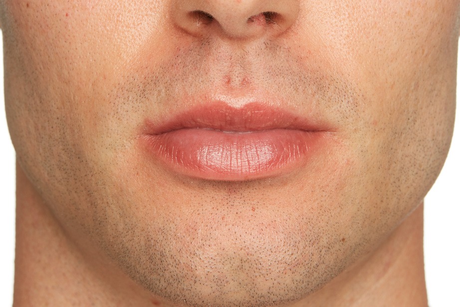 Image of a man lips after lips treatment
