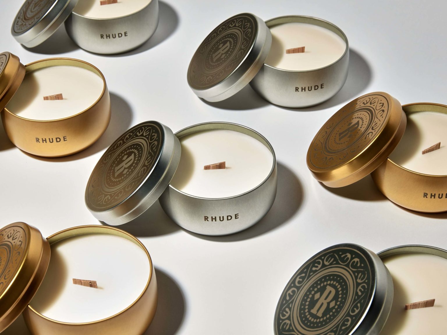 A lot of Rhude silve and gold color tin candles