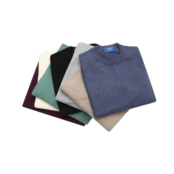 A pile of colored round neck tshits