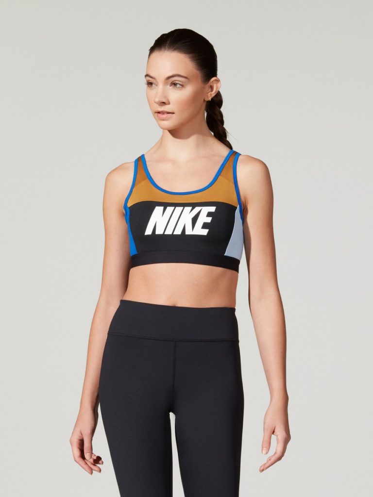 A female model wearing Nike top and trousers